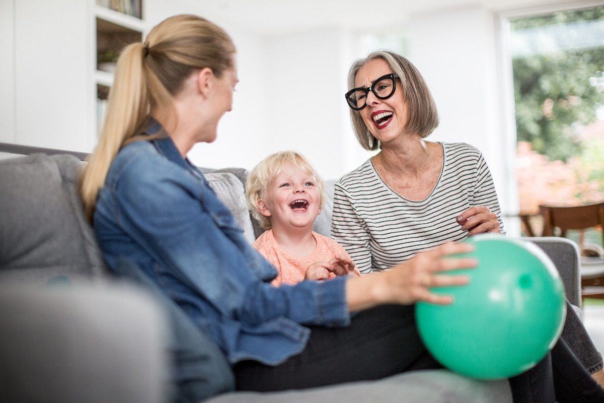 A family laughing and smiling together